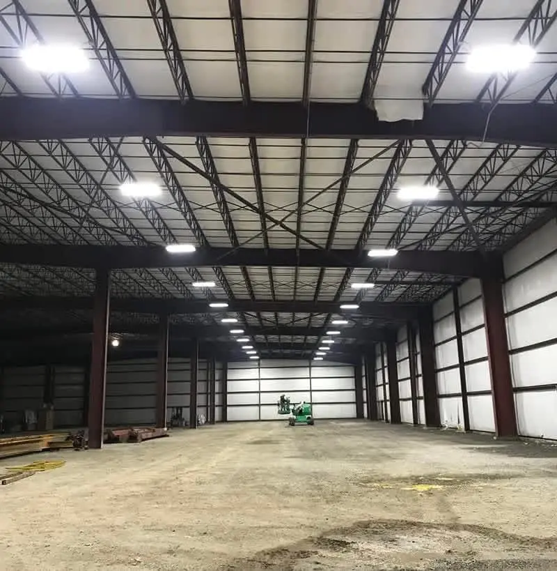 High bay LED lighting installation in a commercial steel building by LiveWire Electrical Service